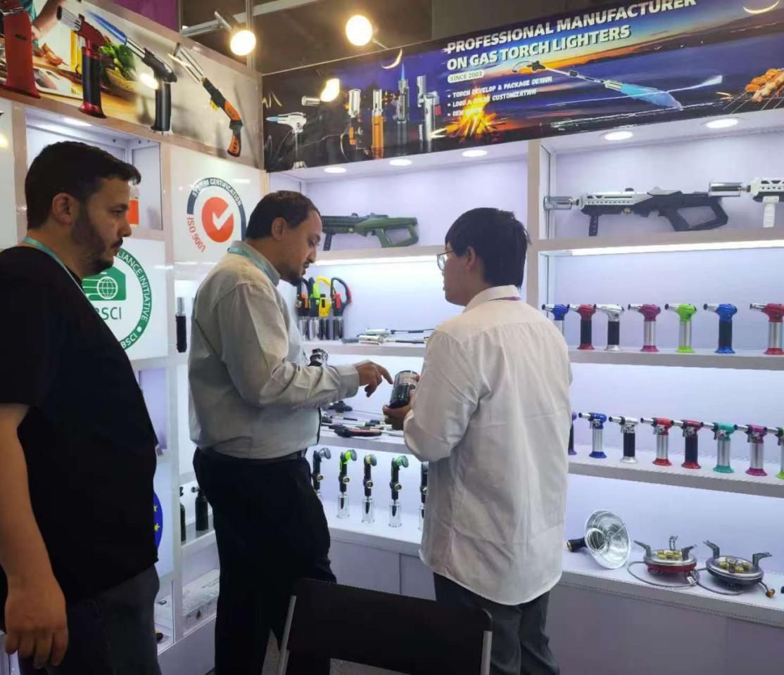 Buyers testing torches at the Zhentanzhe trade fair booth
